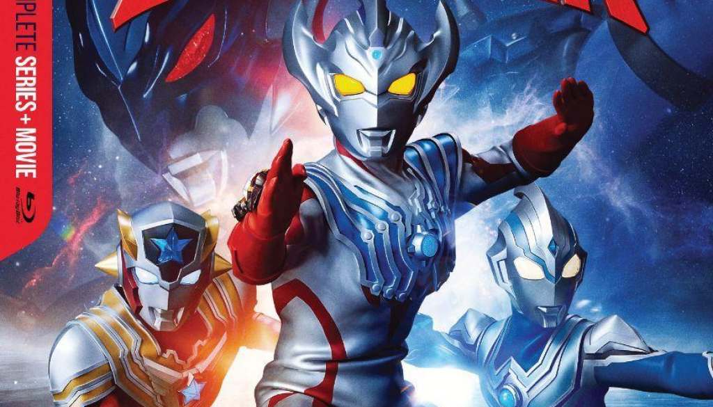 Key art for the cover of the ULTRAMAN TAIGA COMPLETE SERIES blu-ray by Mill Creek. Taiga is front and center, flanked by a red, and a blue, Ultraman, on viewer's left and right. Above them all is the series' logo.