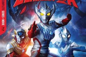 Key art for the cover of the ULTRAMAN TAIGA COMPLETE SERIES blu-ray by Mill Creek. Taiga is front and center, flanked by a red, and a blue, Ultraman, on viewer's left and right. Above them all is the series' logo.