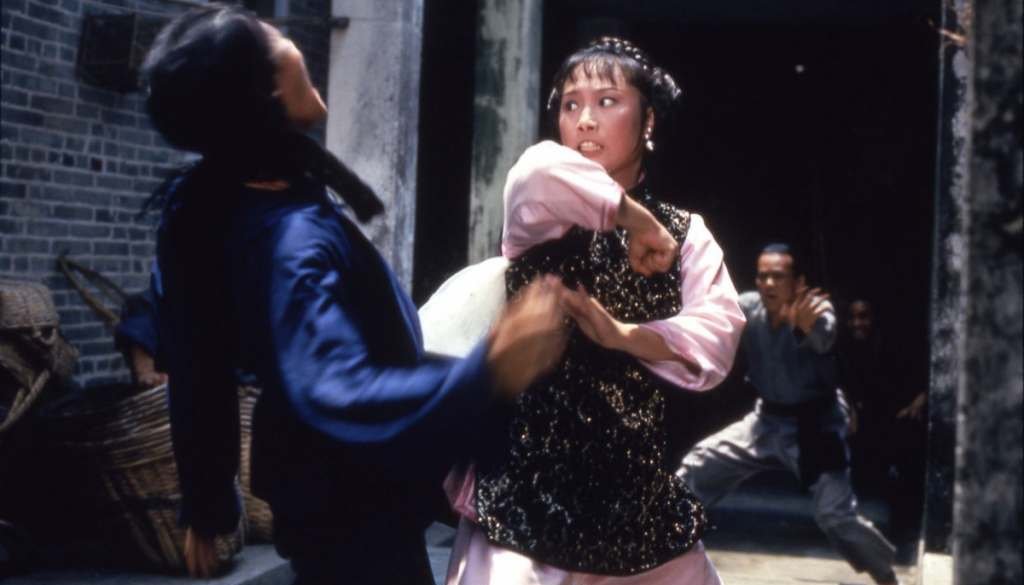 Angela Mao in an action movie still about to strike a henchman as seen in "Broken Oath" (1977)