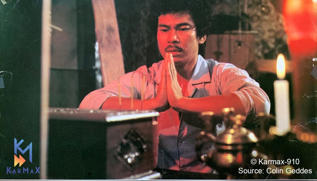 A man prays over a box as seen in a classic film