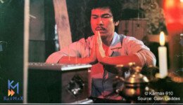 A man prays over a box as seen in a classic film