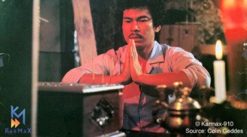 A man prays over a box as seen in a classic film