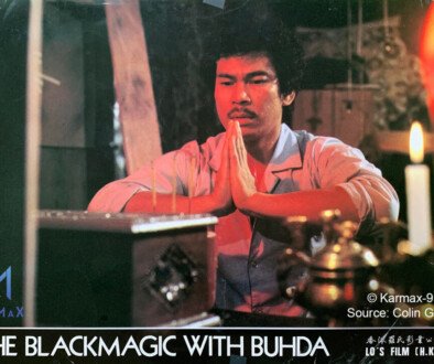 A man prays over a box as seen in a classic film