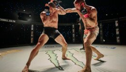 Two men performing a fight scene in a movie