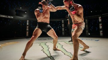 Two men performing a fight scene in a movie