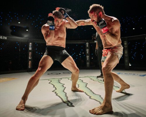 Two men performing a fight scene in a movie