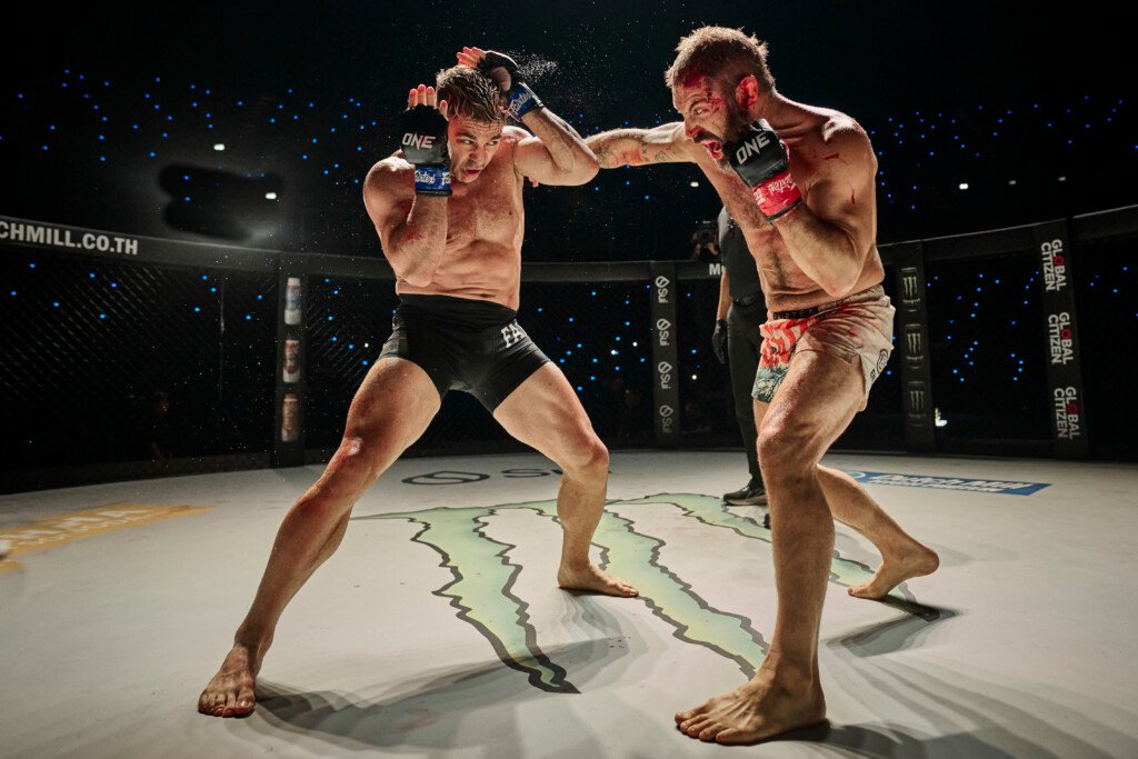 Two men performing a fight scene in a movie
