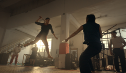 Two people fighting in a gym.